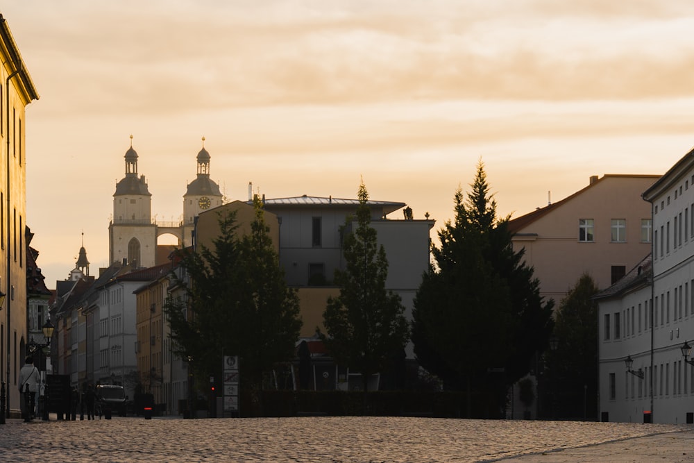 a group of buildings with trees in front of them