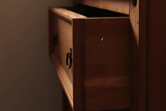 Drawer-style boxes partially open, revealing smooth sliding mechanisms and elegant interiors.