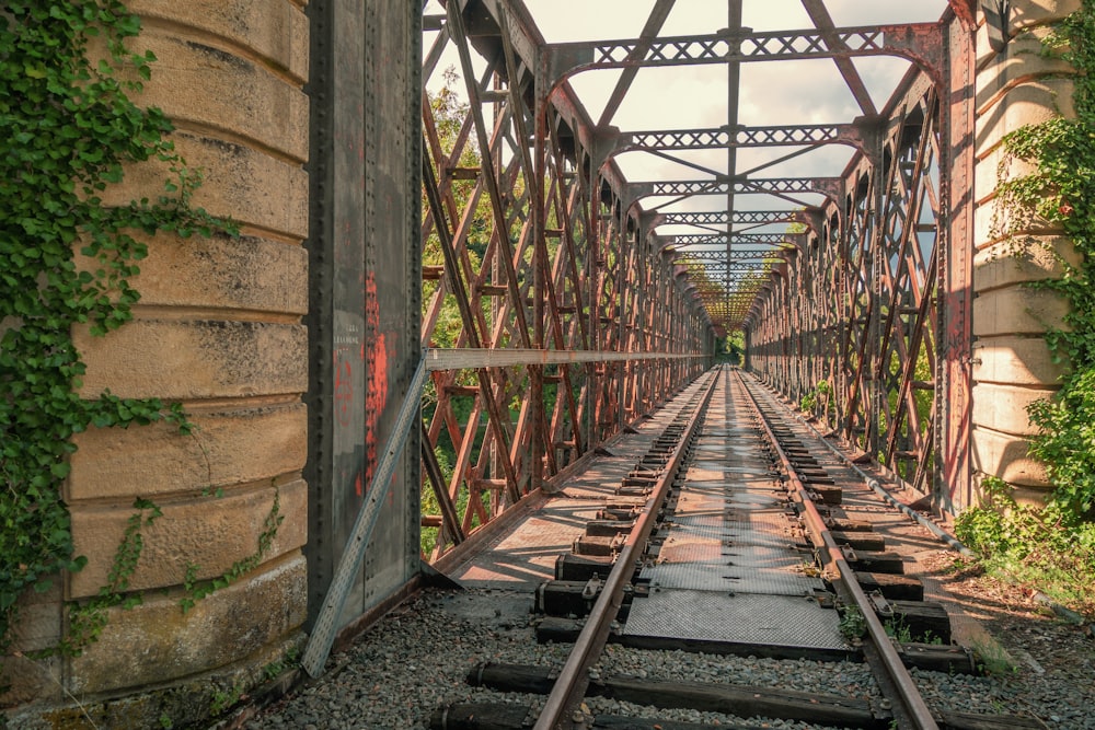 a train track with brick walls