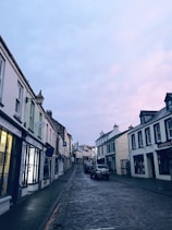 a street with cars parked on the side