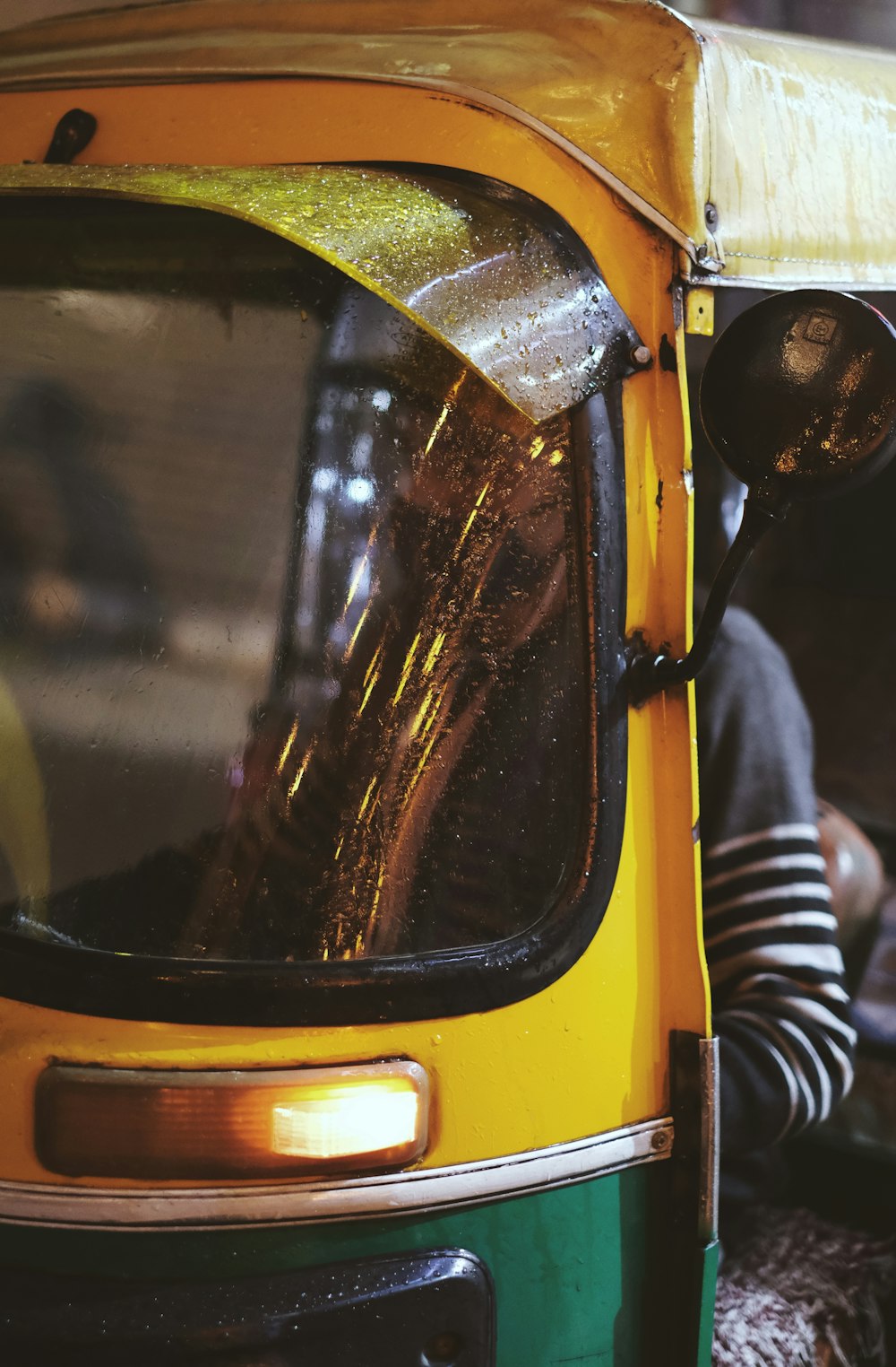 a yellow vehicle with a broken front window