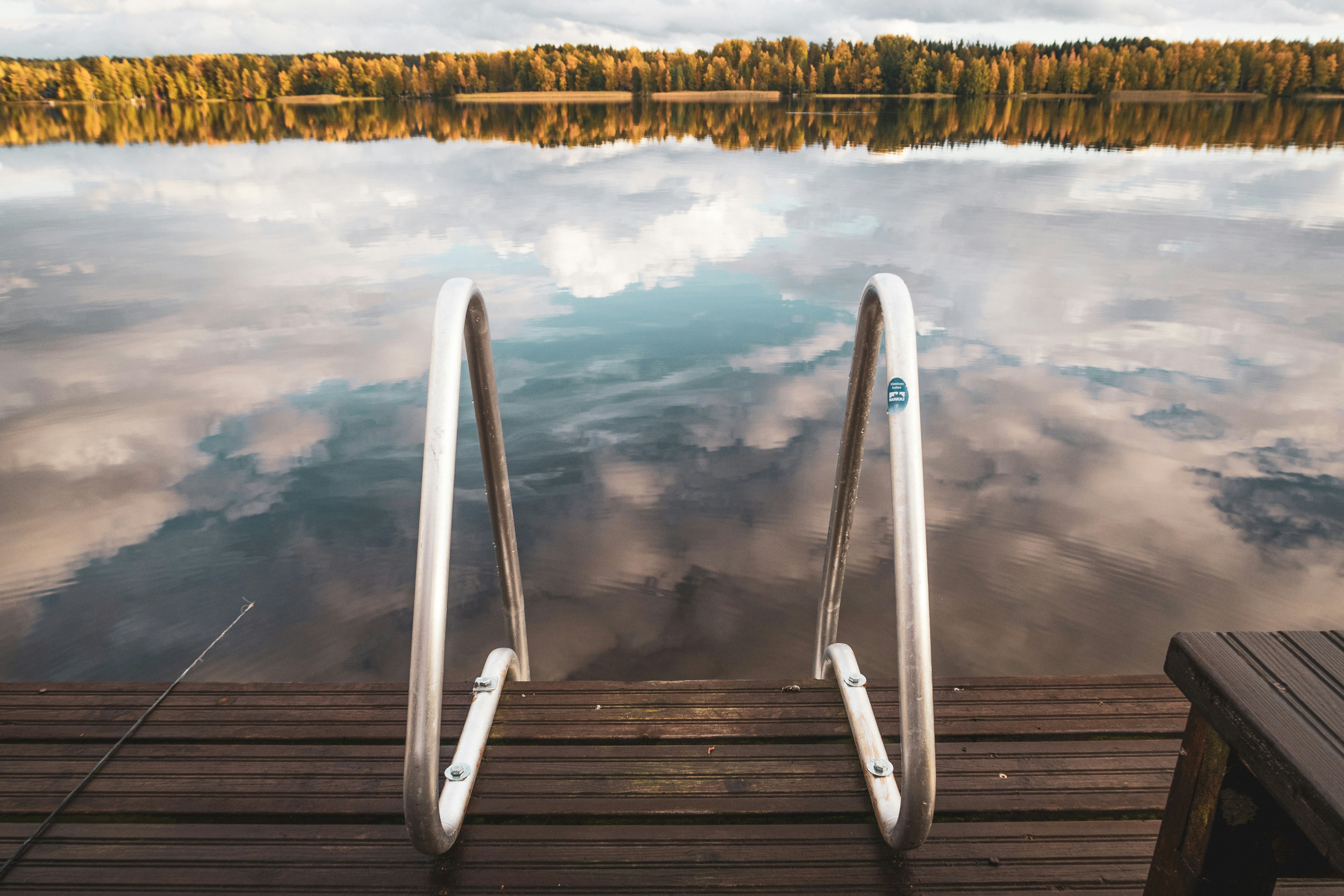 a dock with a body of water in the background