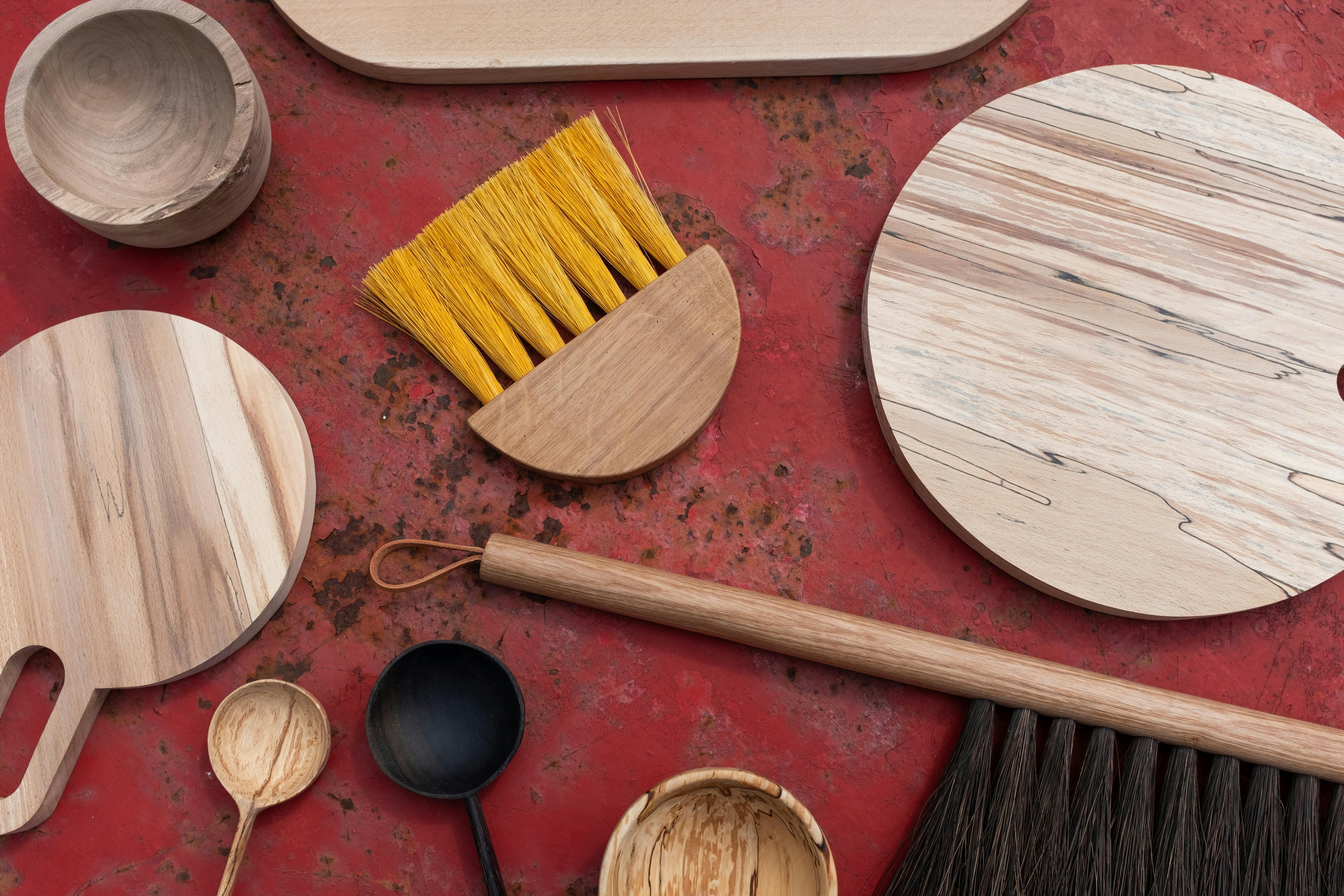 a group of wooden spoons on a wooden surface
