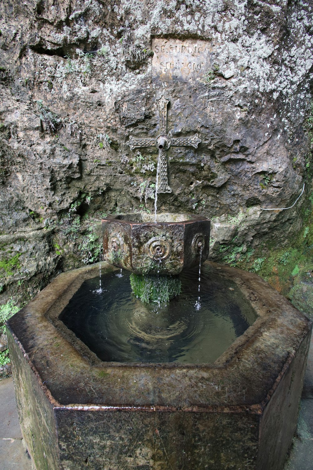 a water fountain in a cave
