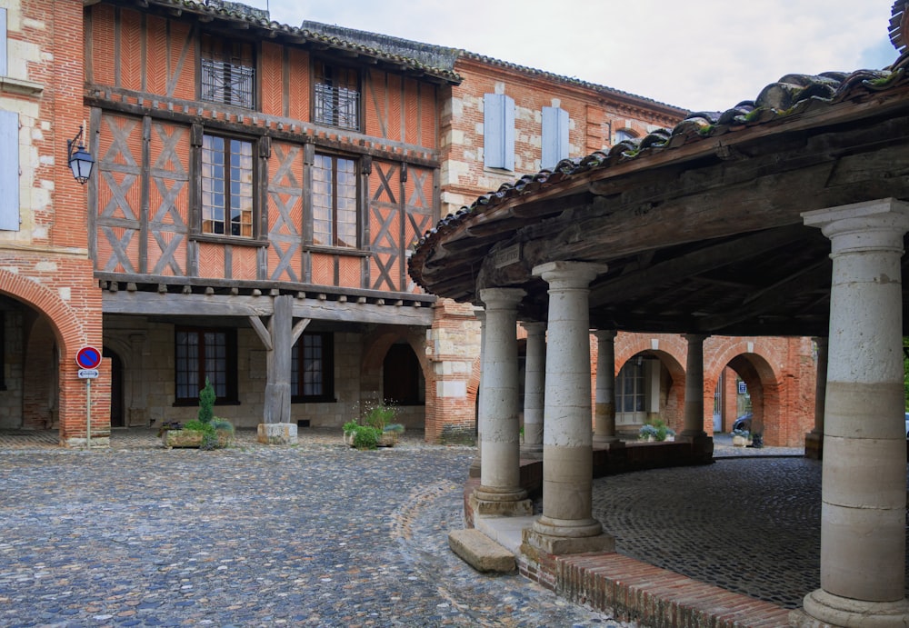 a courtyard with a building in the background