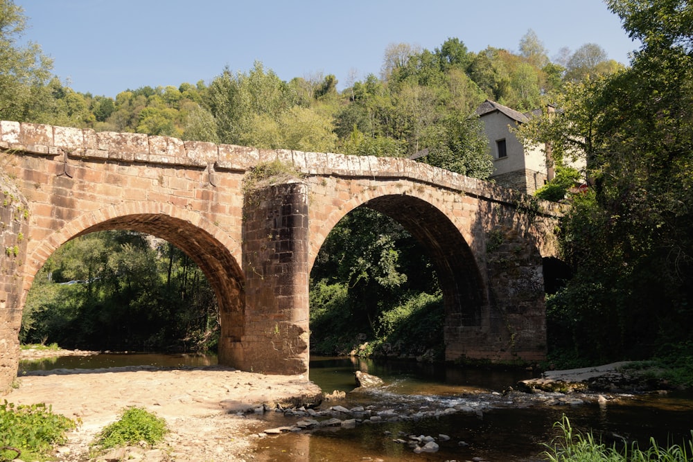 a stone bridge over a river