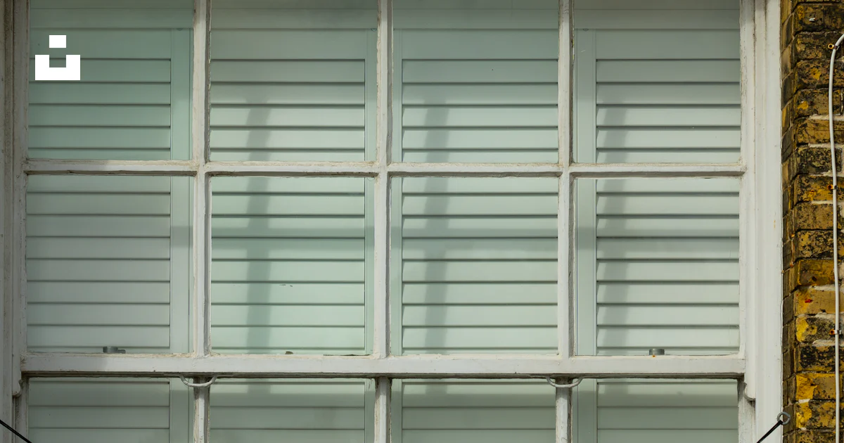A sign on a building photo – Free Window Image on Unsplash