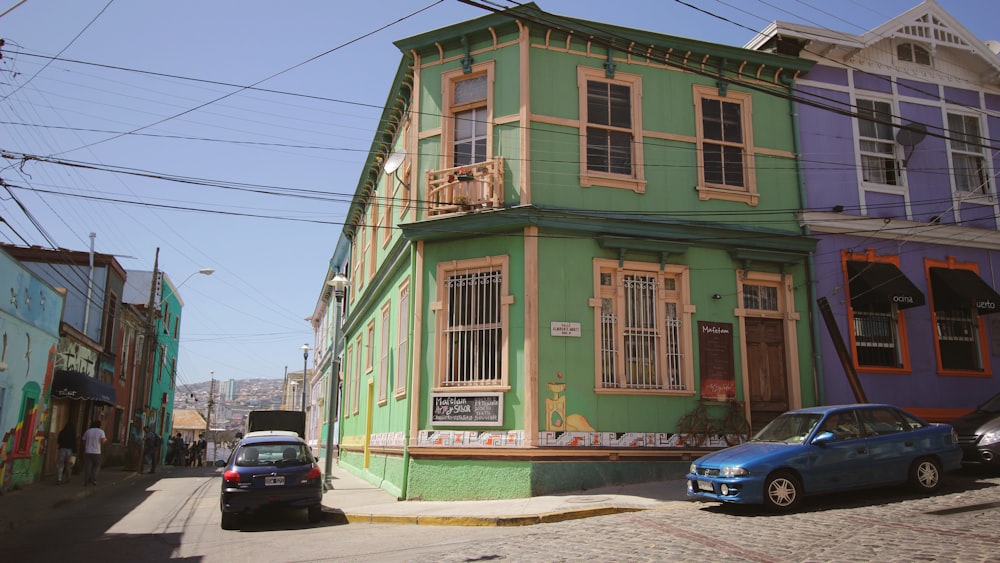 a street with cars parked on it and buildings on the side