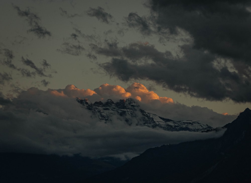 a mountain range with clouds