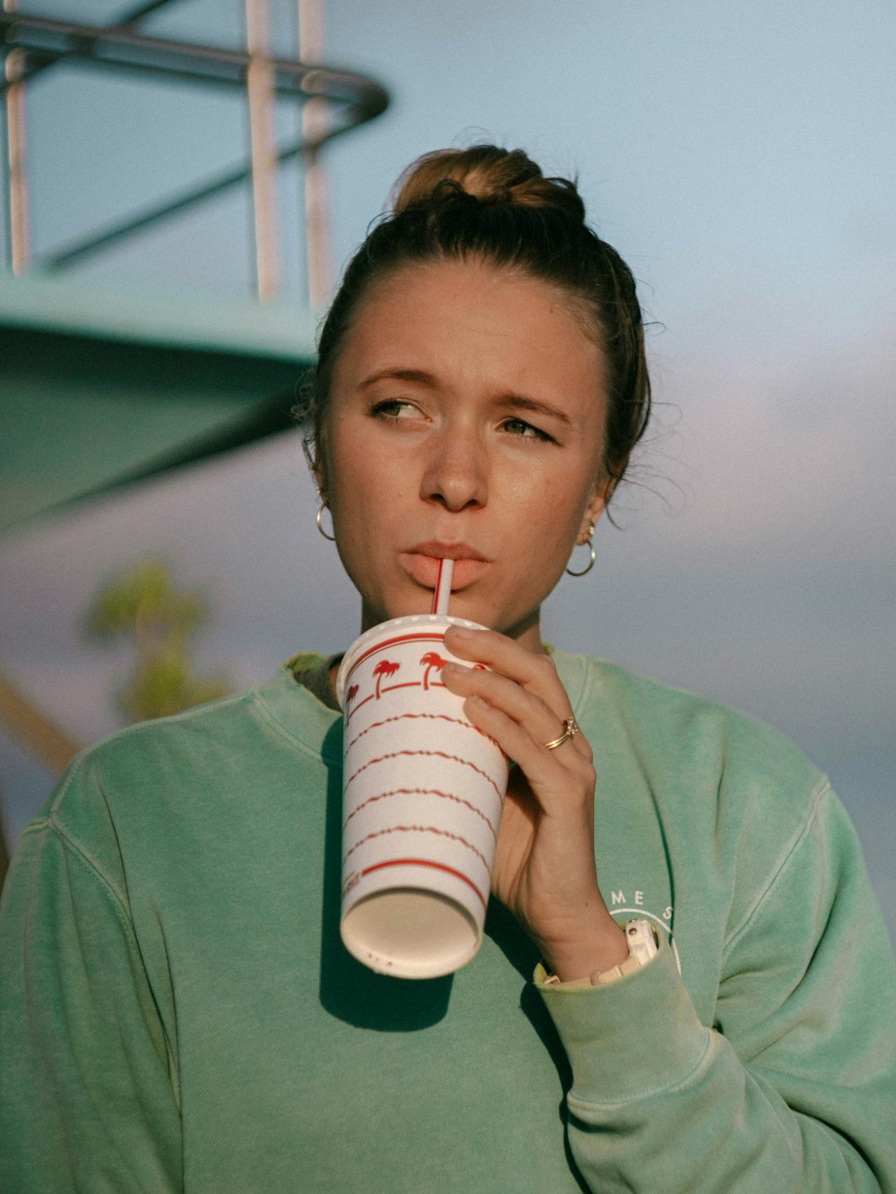 a person drinking from a cup