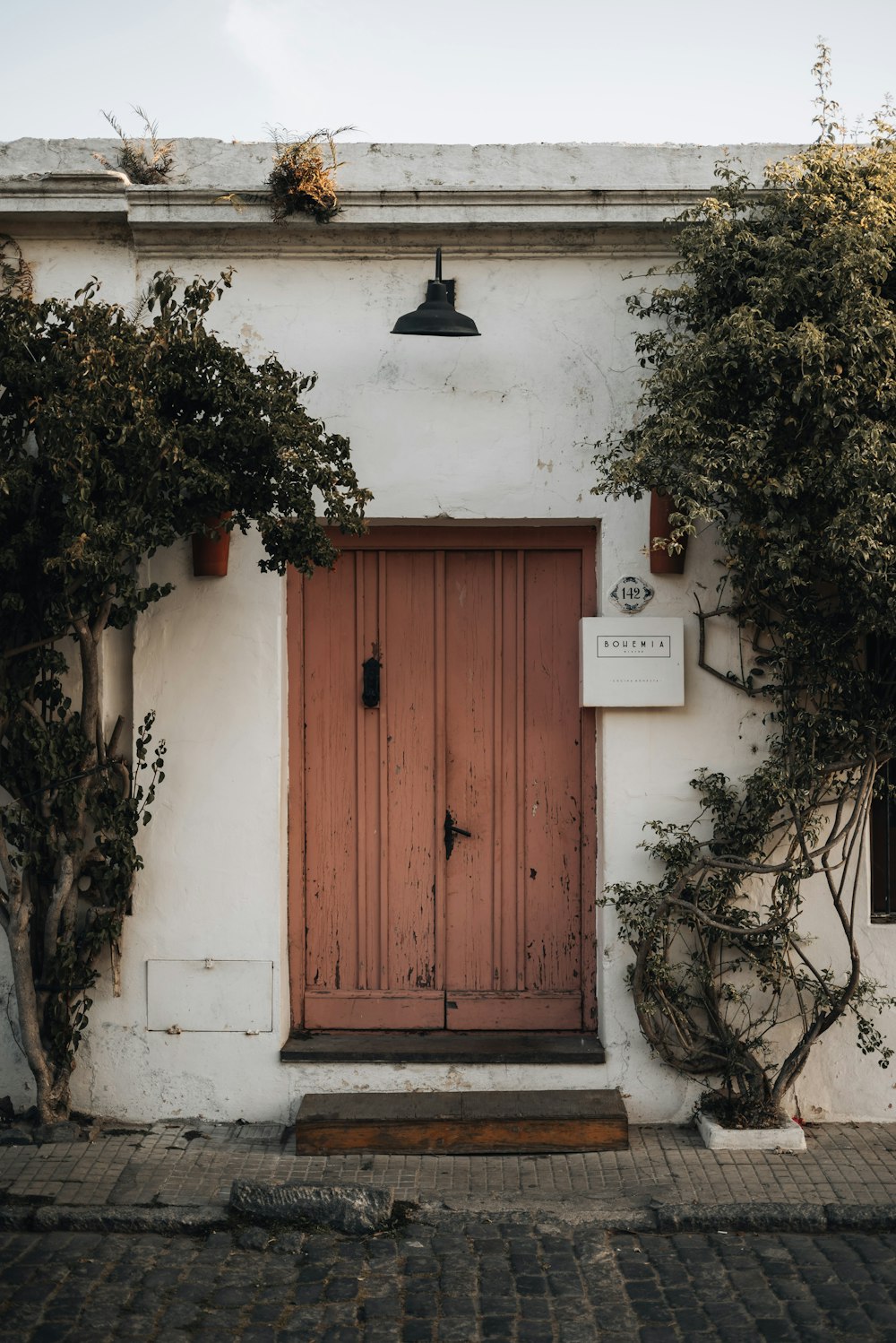 a door with a bell on top