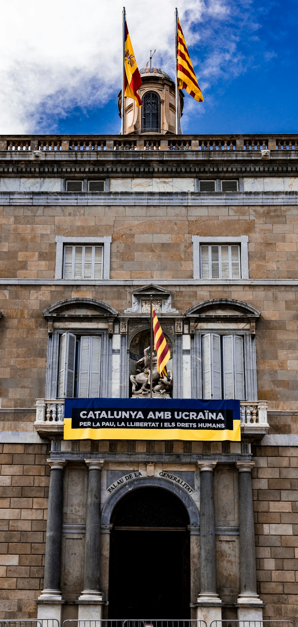 a building with flags on the front