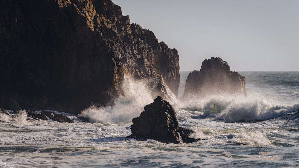 waves crashing against a rock