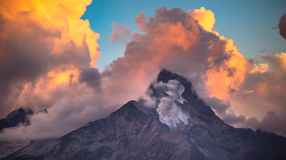 a mountain with clouds