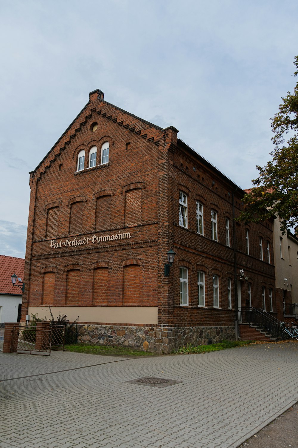 a brick building with a sign on it