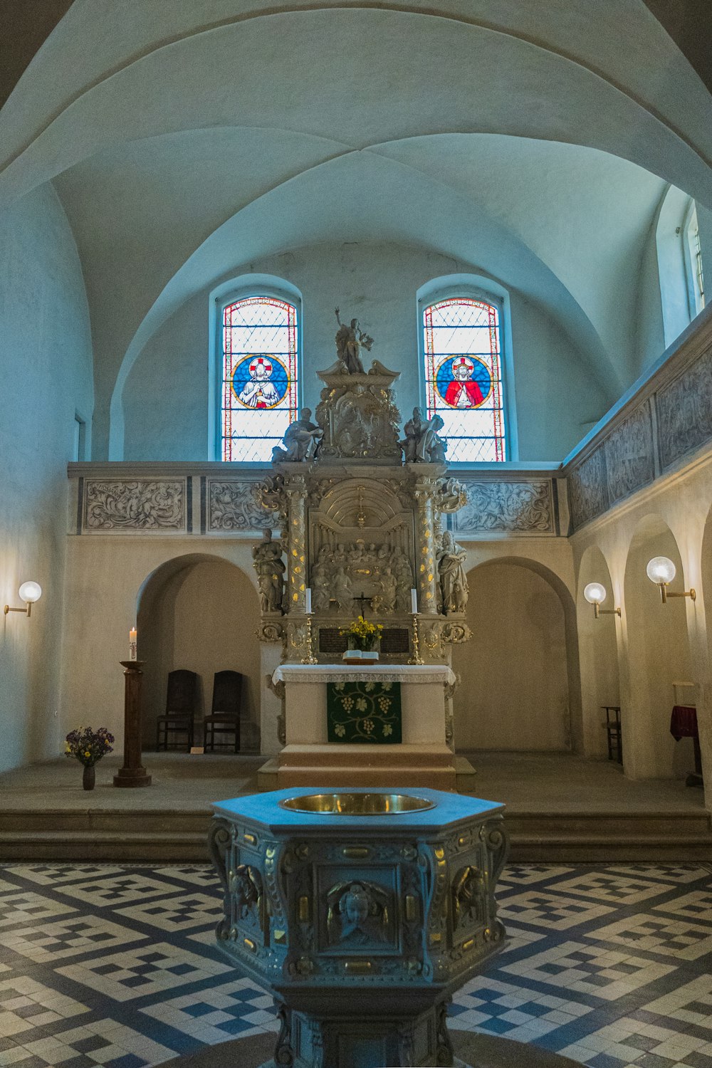 a large room with a statue in it