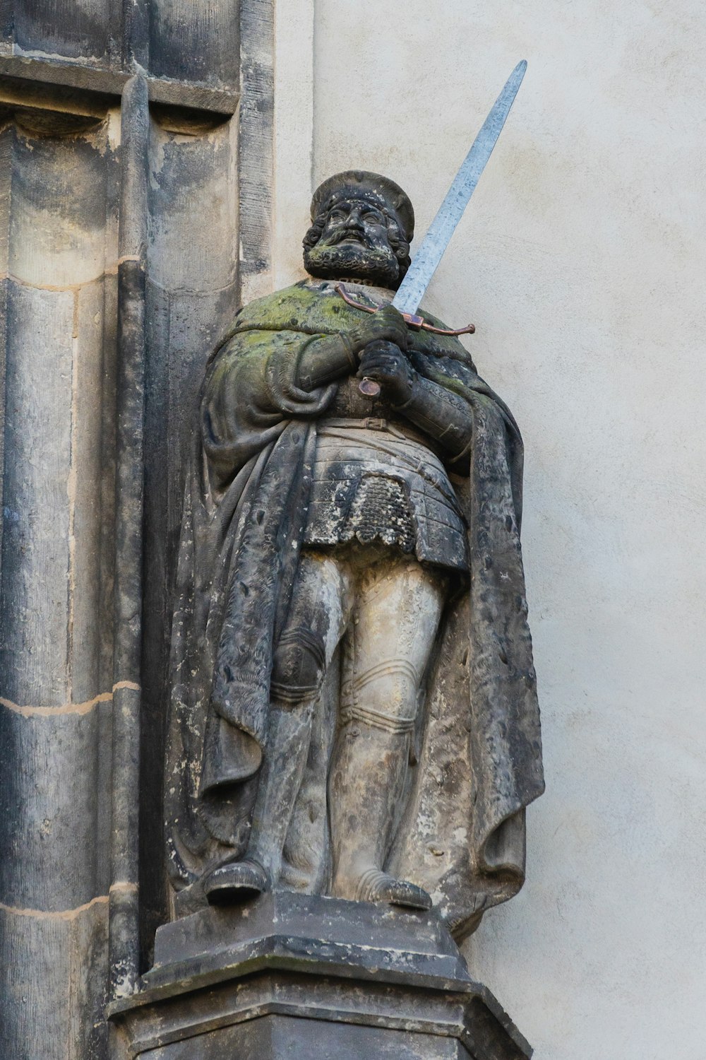 a statue of a person with a sword