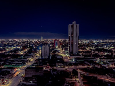 Nighttime cityscape of Comunidad de Madrid illuminated with vibrant lights and iconic architecture.