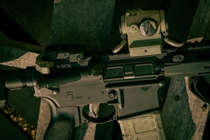 A close-up of a firearm being handled safely.