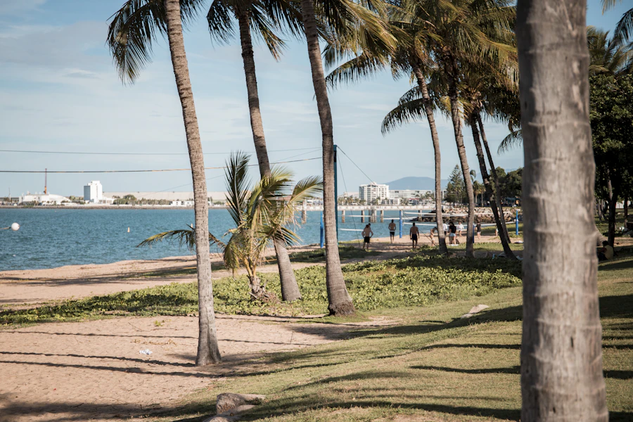 TSS support worker and participant enjoying a day out at The Strand, Townsville
