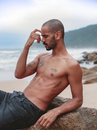 a man with a beard and tattoos