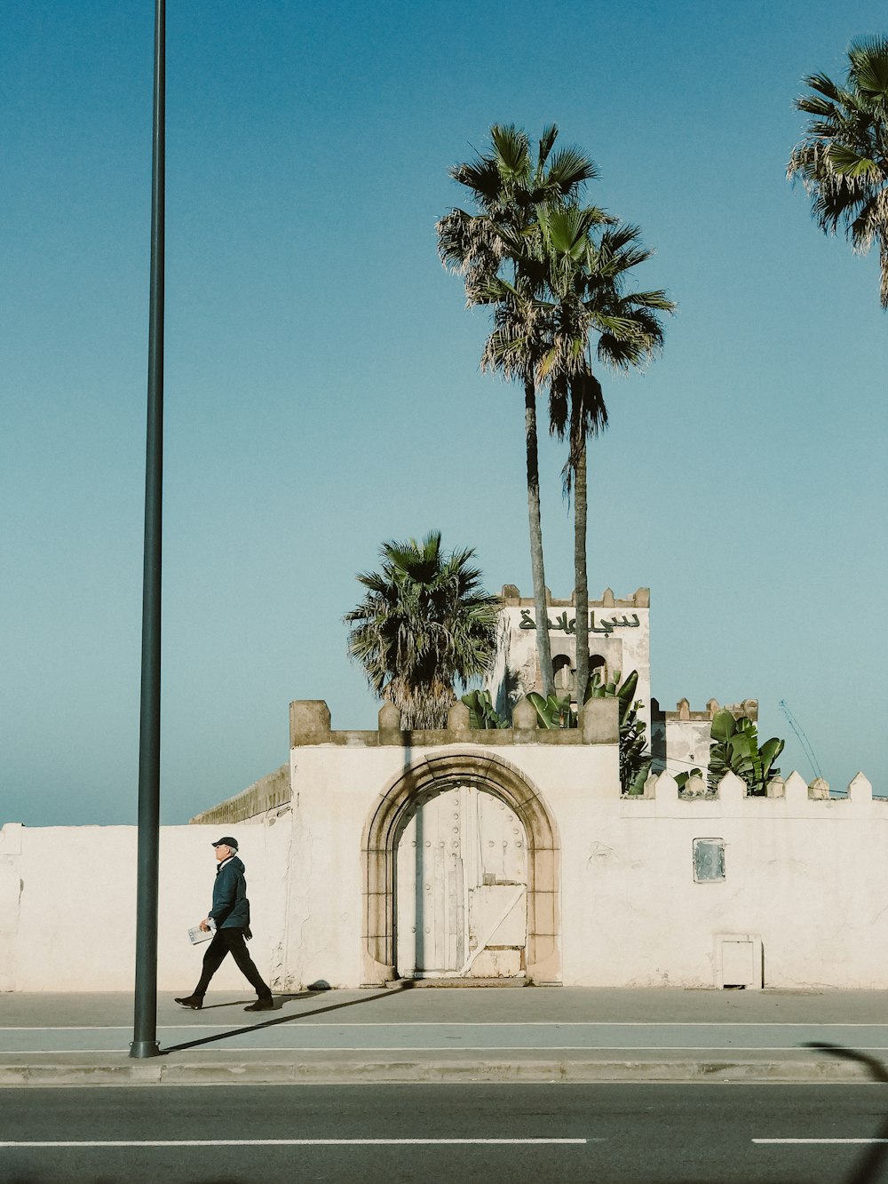 a person walking on the sidewalk