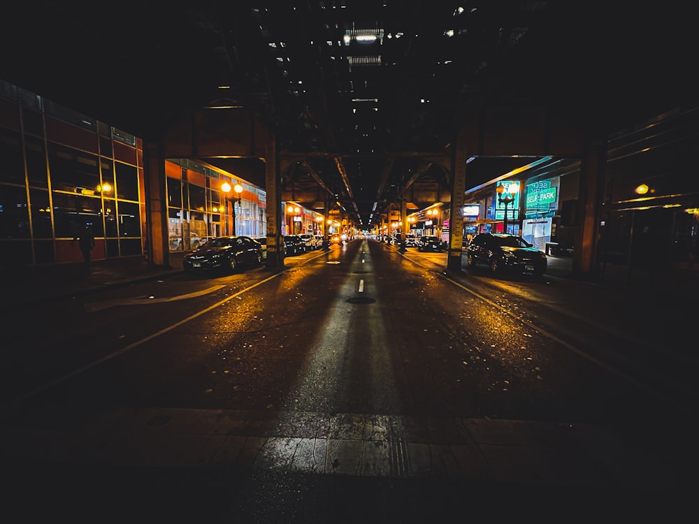 a street with cars on it and buildings on the side