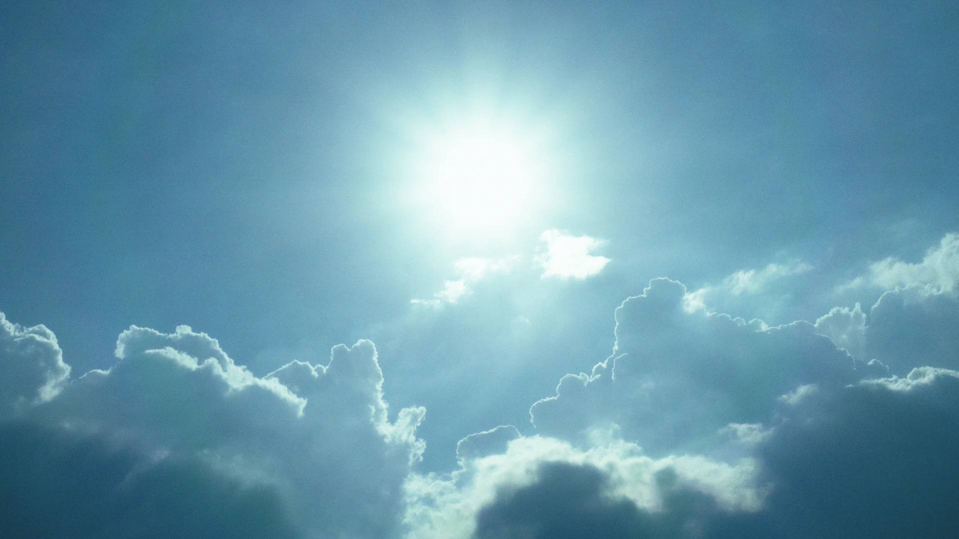 sun shining through clouds