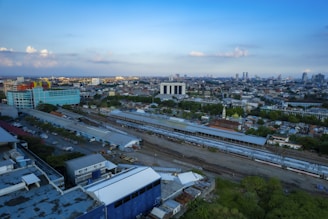 Cityscape with trains seamlessly connecting urban and suburban areas.