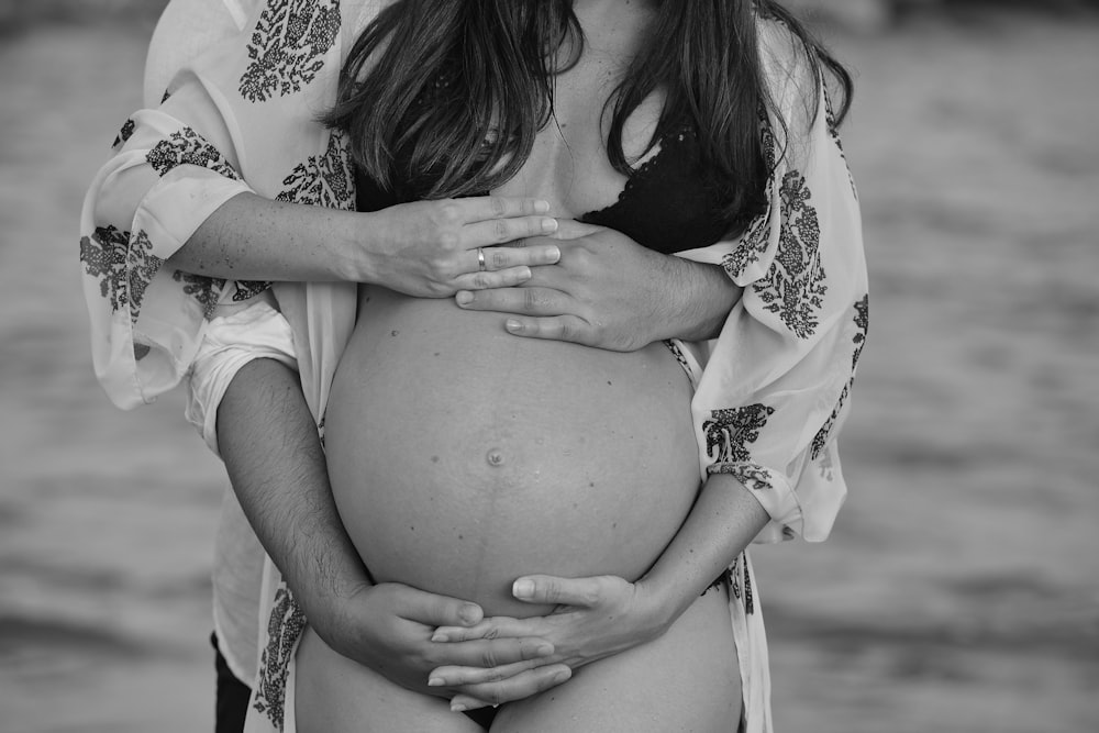 a woman holding a baby