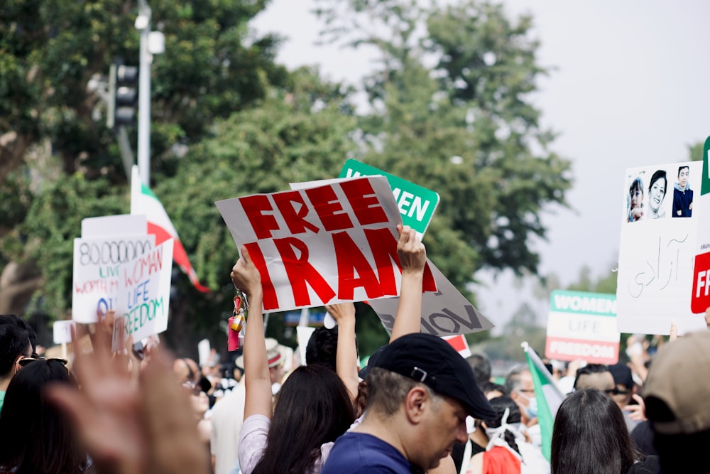 a group of people holding signs