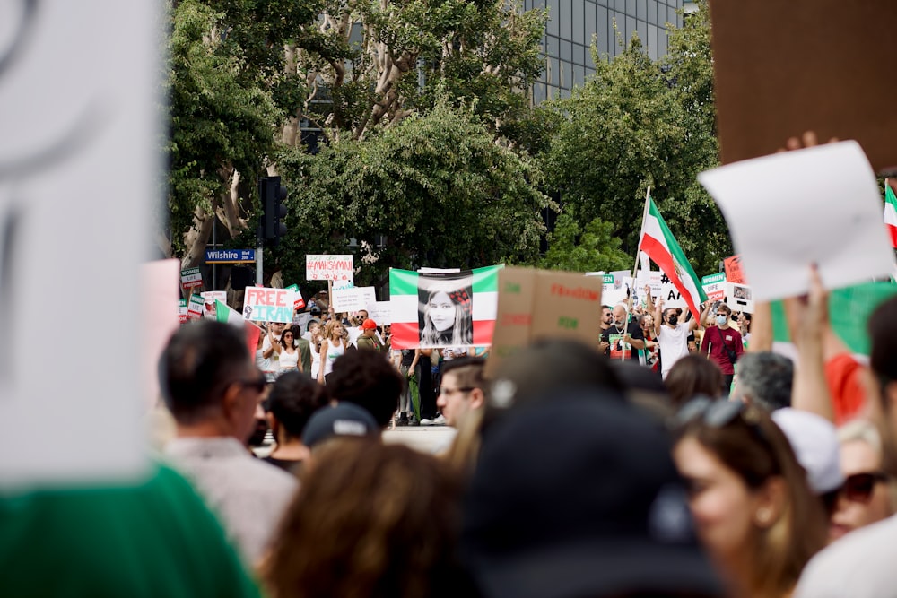 a group of people holding signs