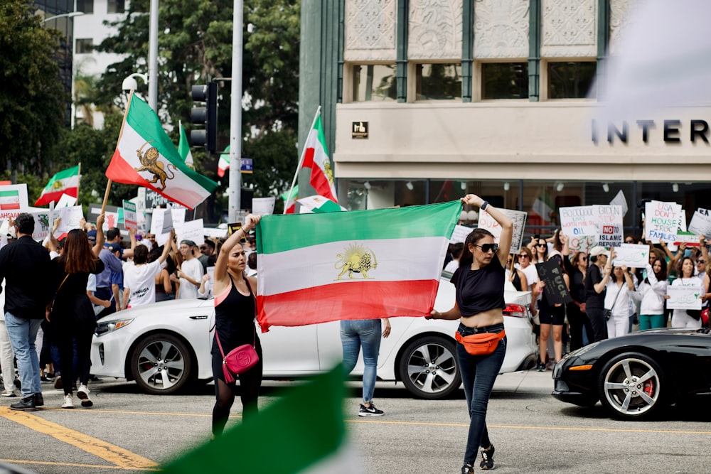 a group of people holding flags