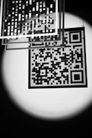 A glowing QR code framed in gold, linking readers instantly to the evolumente portal.