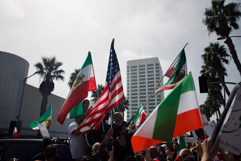 a group of people holding flags