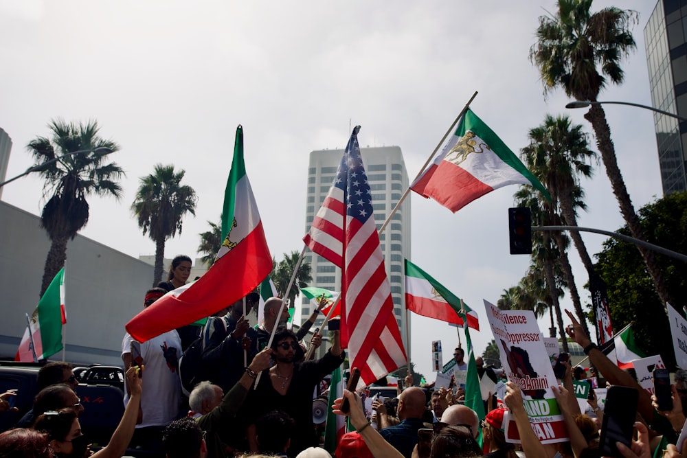 a group of people holding flags