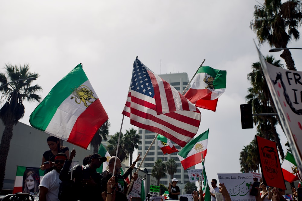 a group of people holding flags