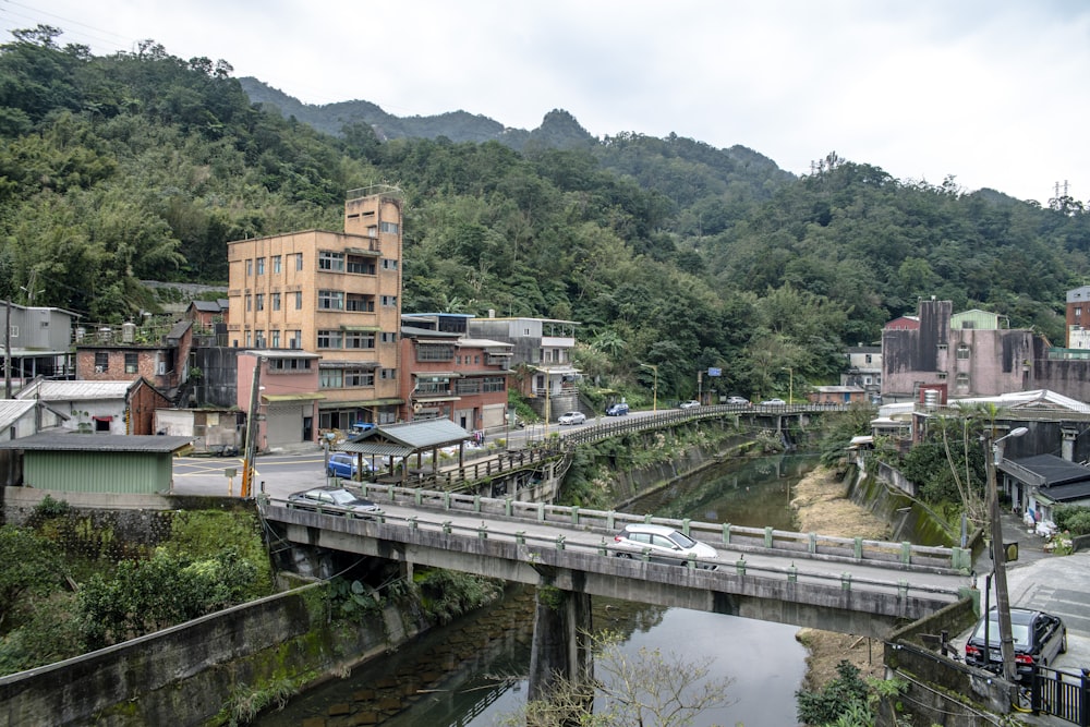 a bridge over a river with buildings on the side