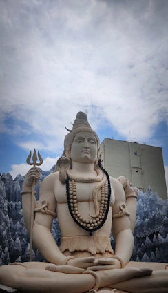Shri Sumitacharya Ji Maharaj meditating peacefully in front of the Shiva temple he built.