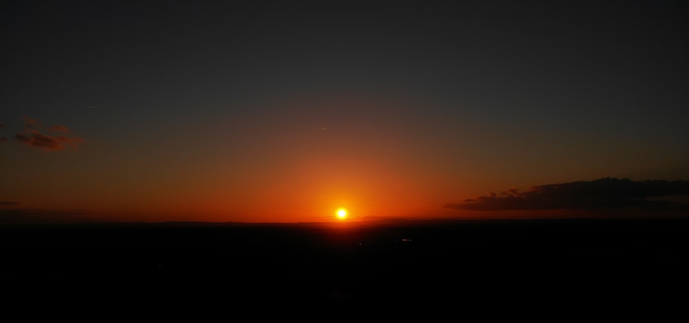 a sunset over a body of water