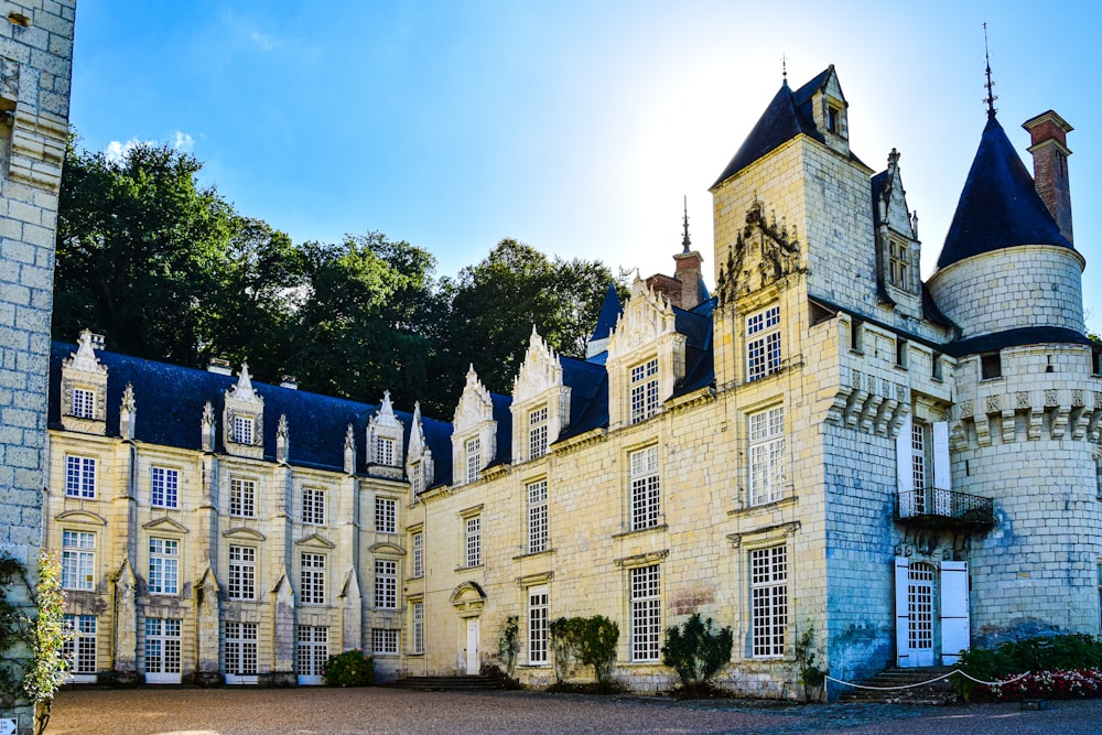 a large building with trees in the background