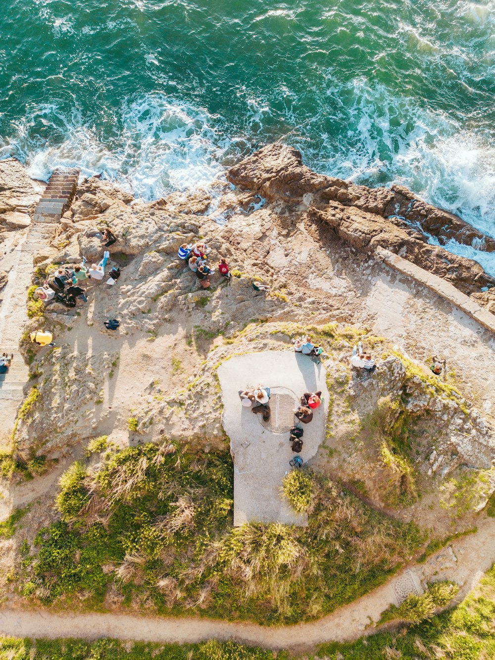 a group of people on a cliff