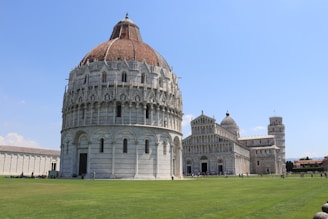 Historic landmark in Xanxerê with detailed architecture and visitors enjoying the site on a sunny day.