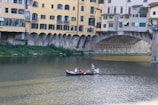 A scenic view of a river with tourists enjoying a boat ride.