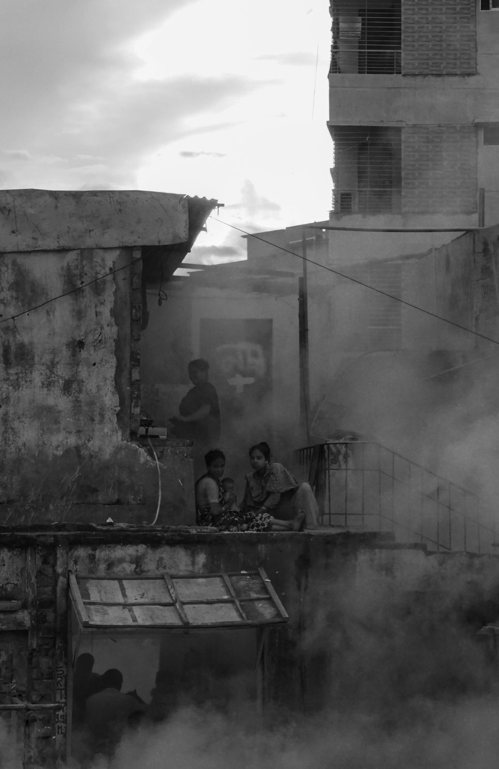 a group of people sitting on a roof