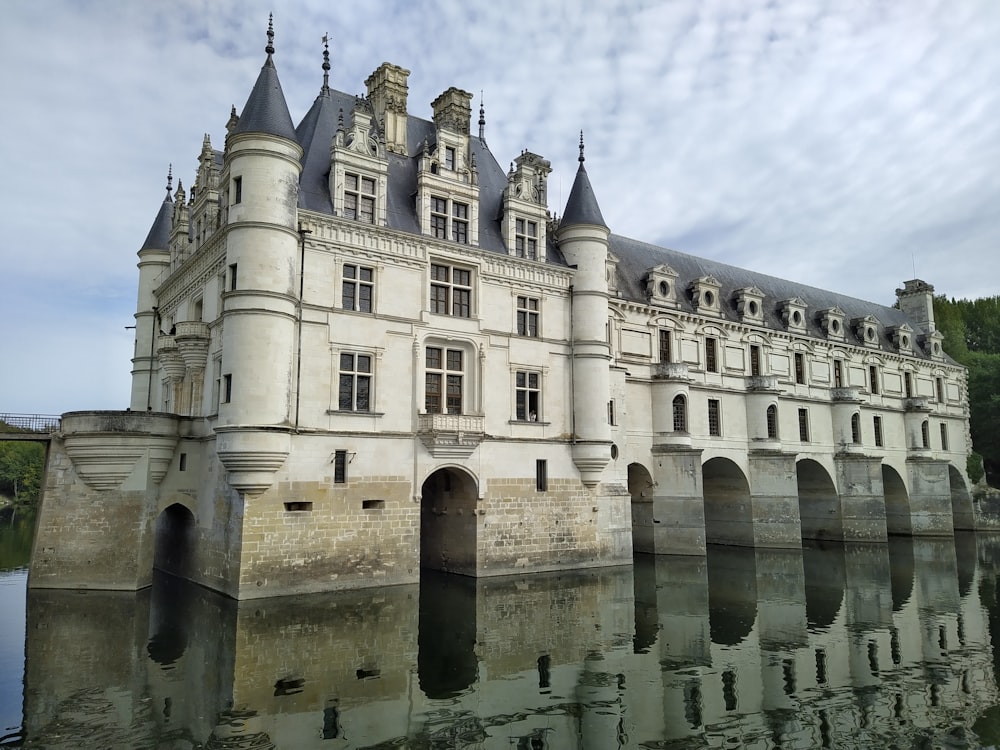 a large white castle with Château de Chenonceau in the background