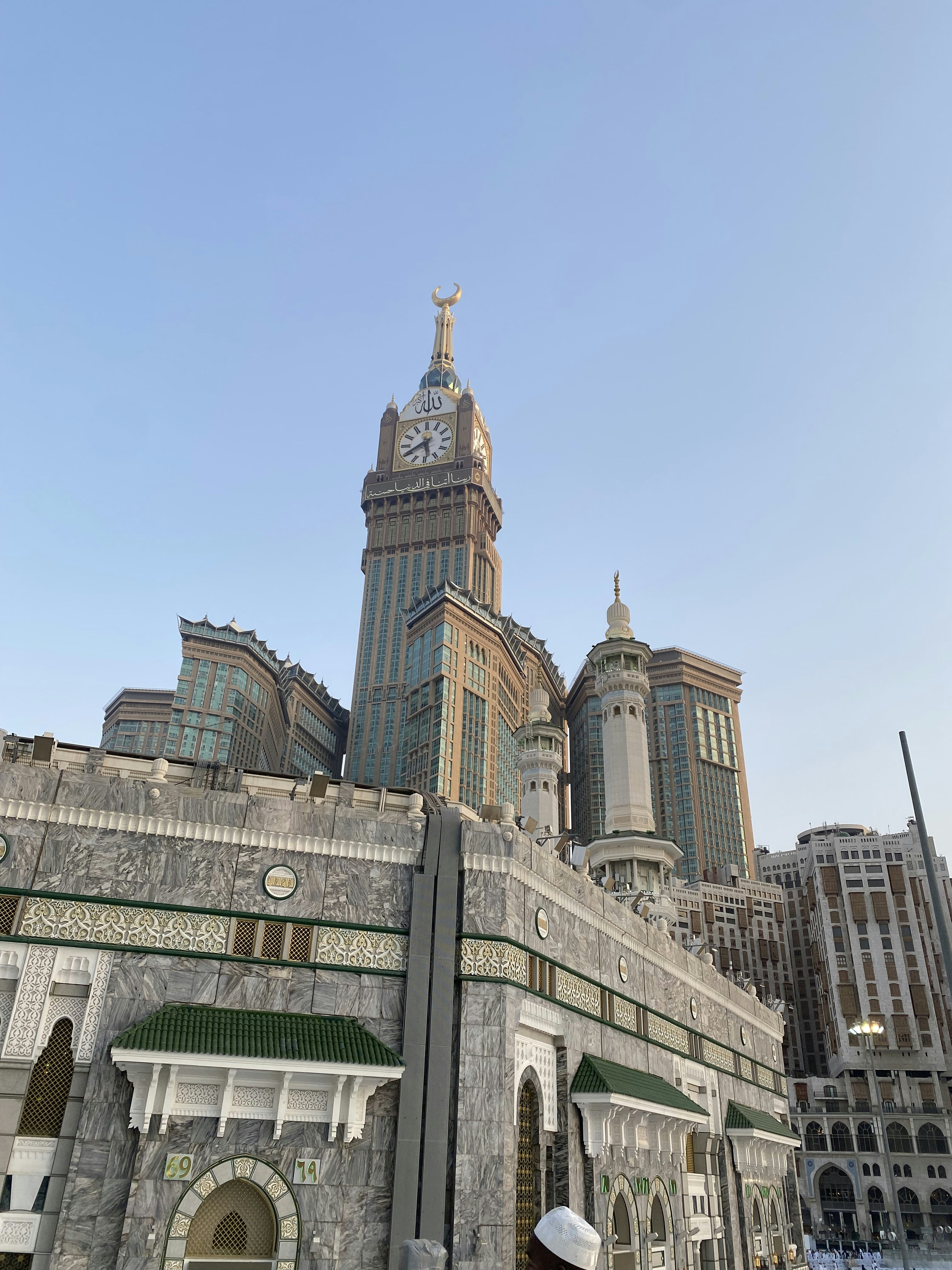 a large building towers over a city