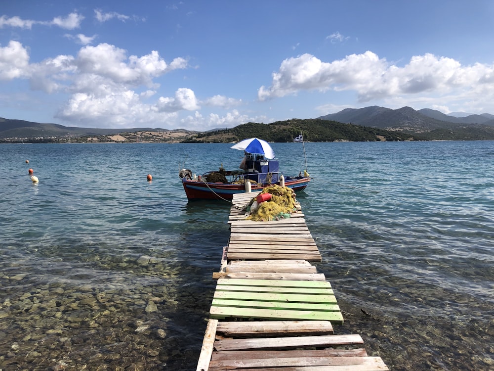 a boat is parked on the shore