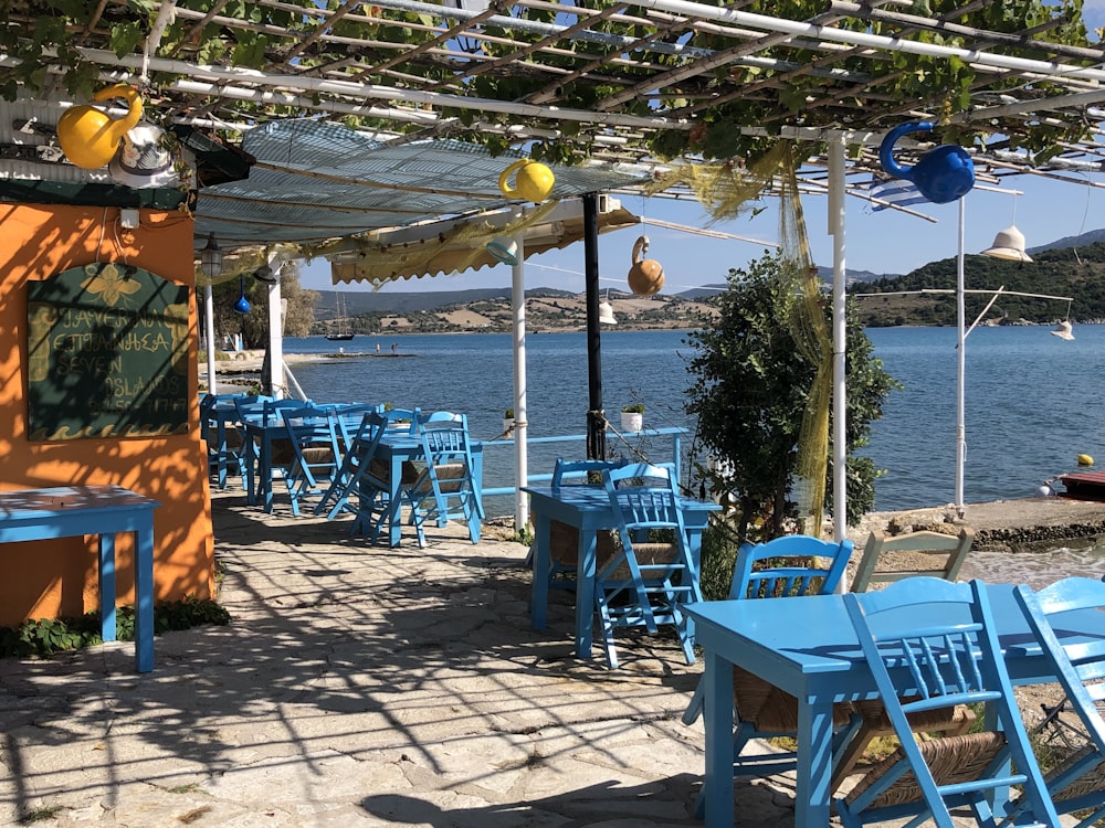 a patio with tables and chairs