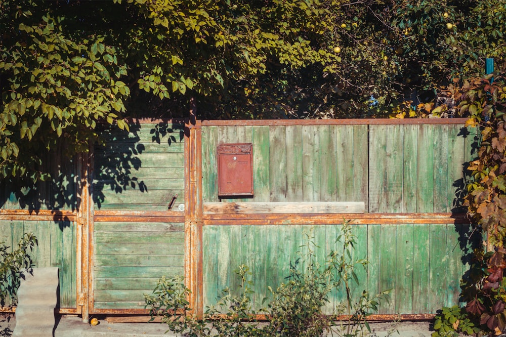 a shed with a fence around it